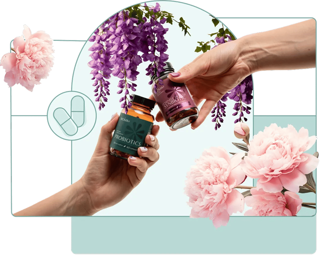 Hands holding Bioma probiotic bottles surrounded by florals