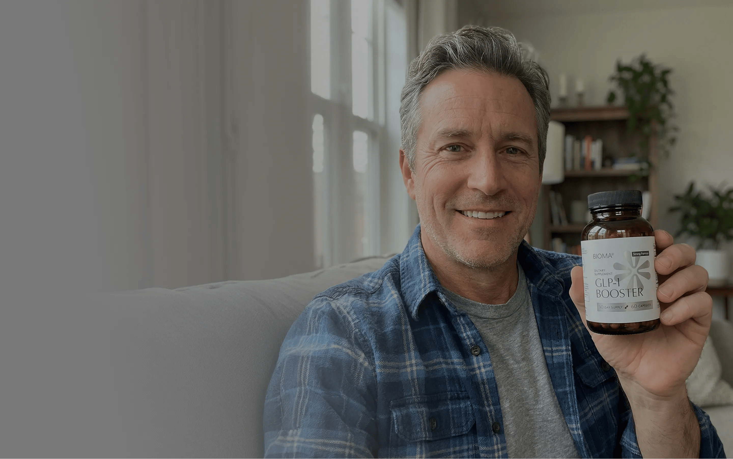 Man holding a Bioma GLP-1 Booster bottle