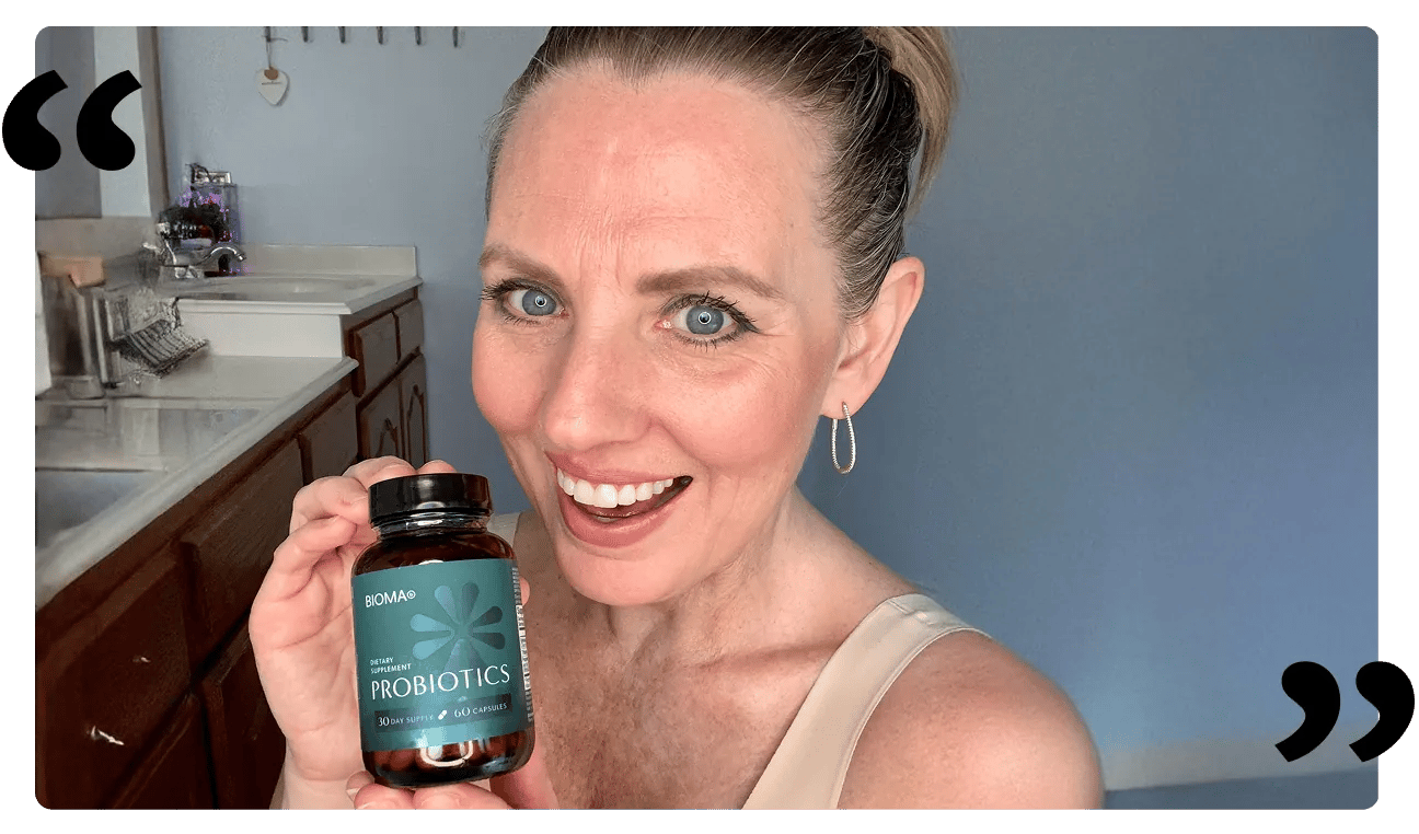 Bioma customer holding a probiotics bottle, framed by quotation marks