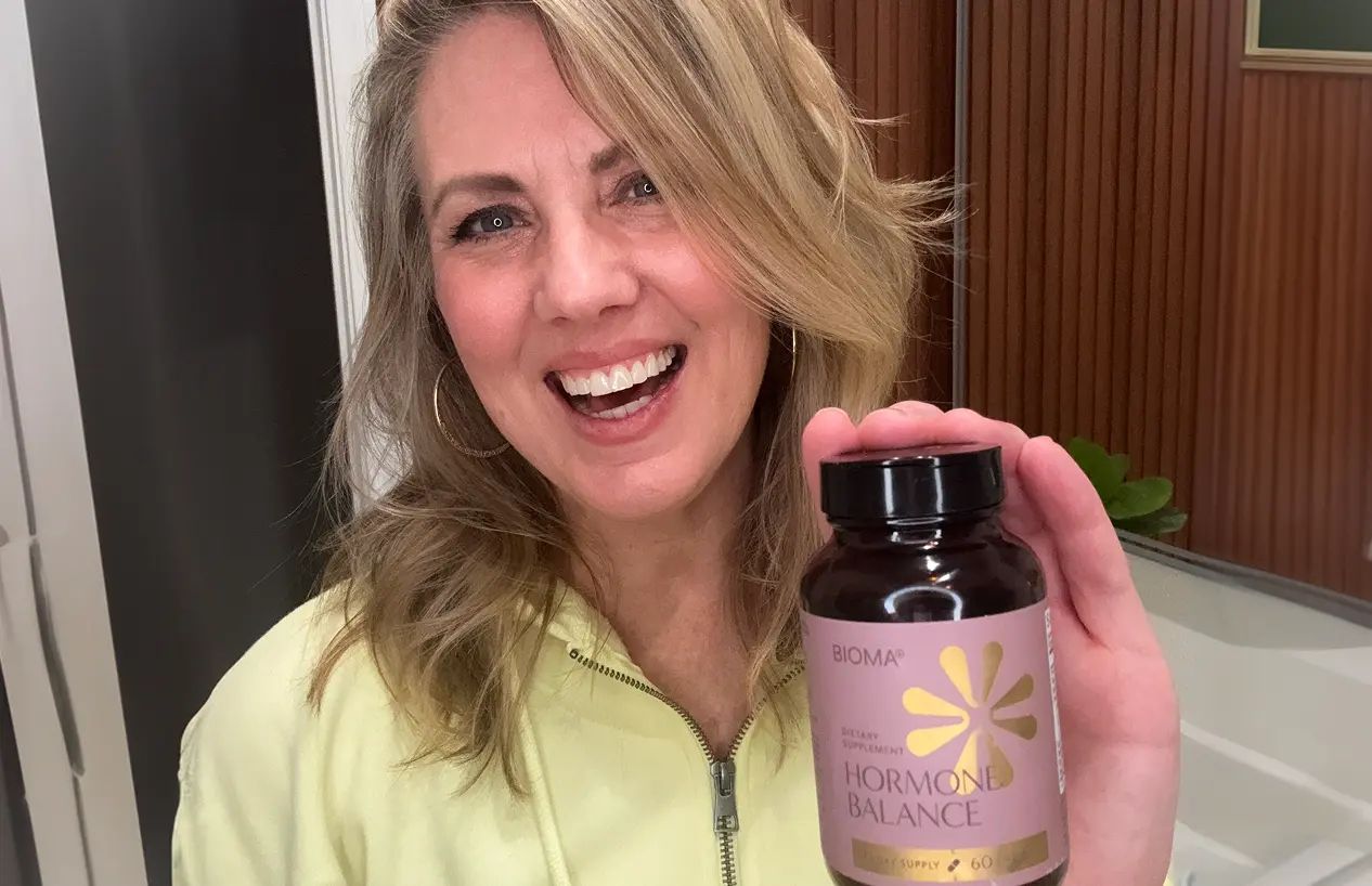 Bioma Hormone Balance customer holding a bottle
